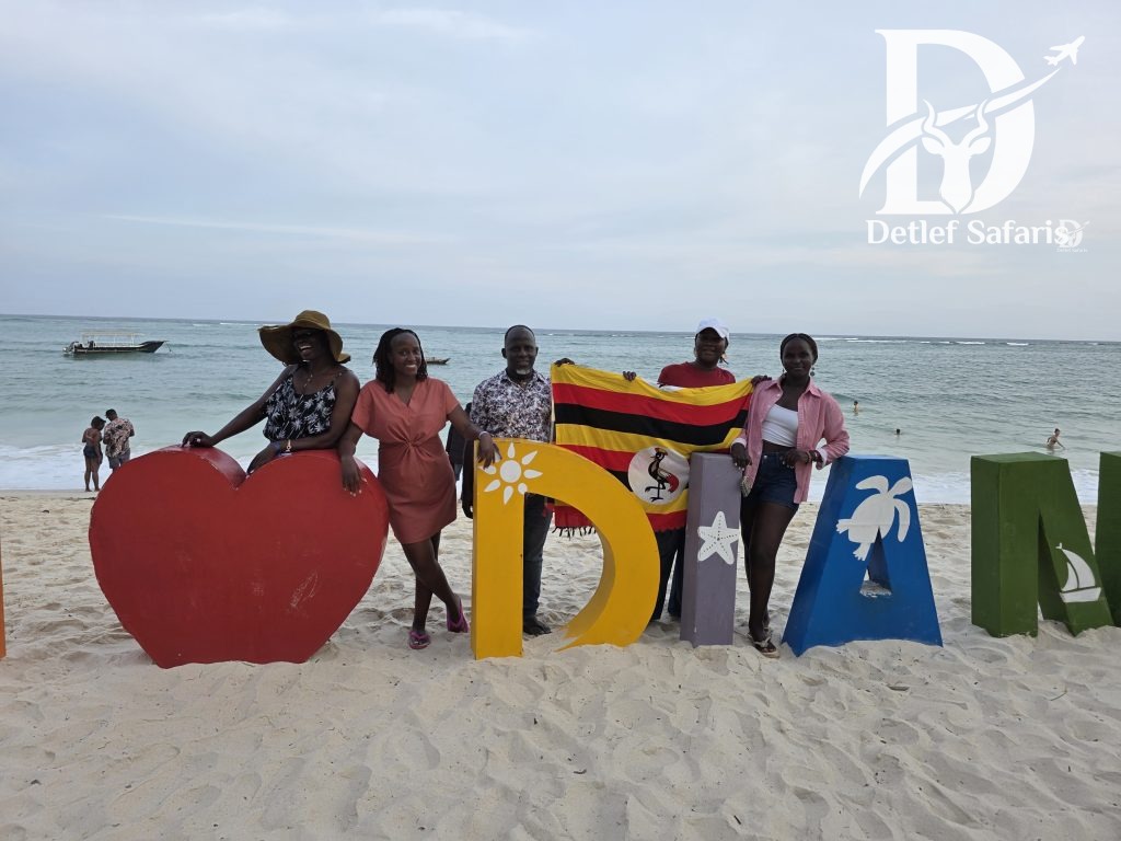 Group photo at the Diani Beach sign, Kenya