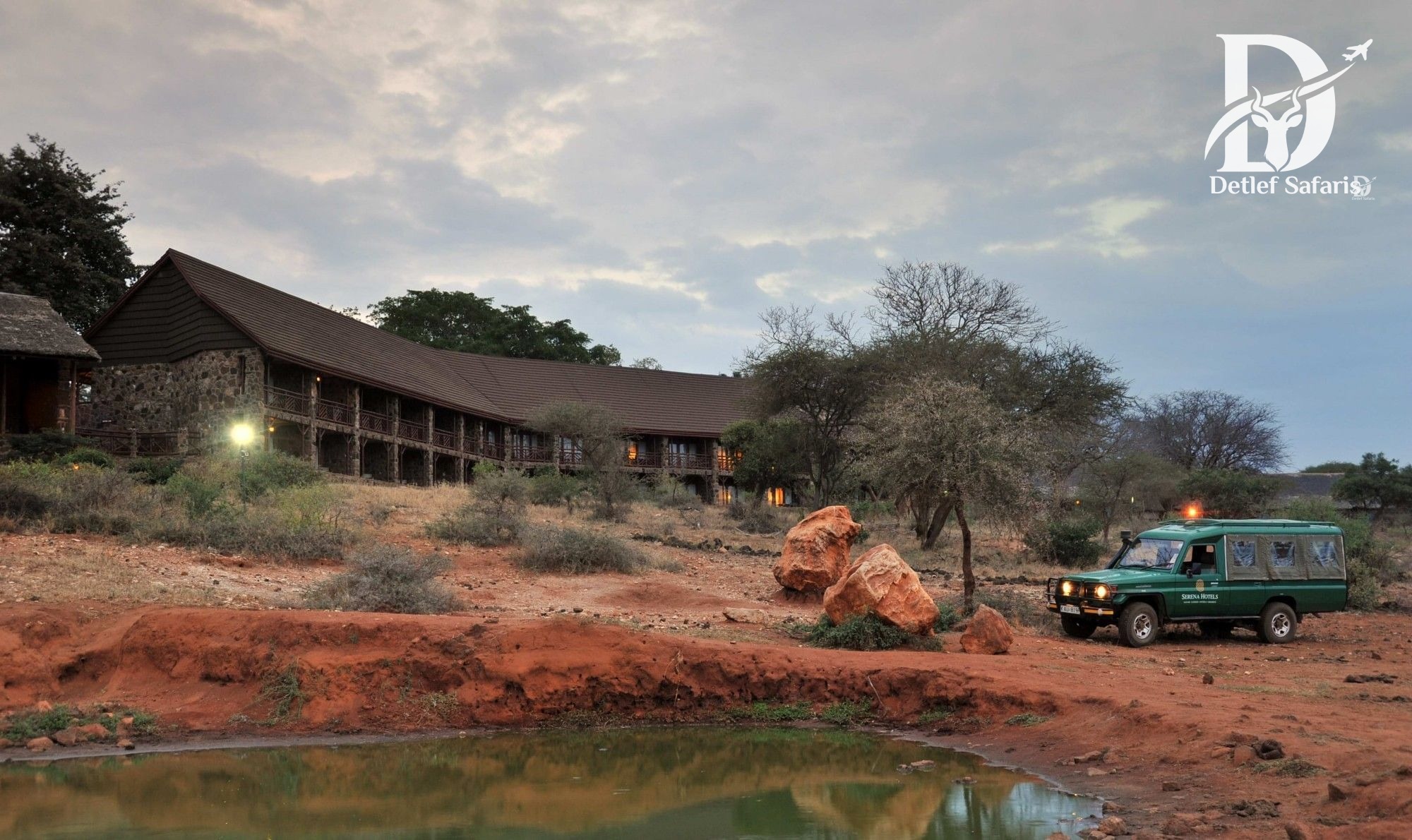 Kilaguni Serena Safari Lodge overlooking a waterhole with Mount Kilimanjaro behind, Tsavo West National Park, Kenya