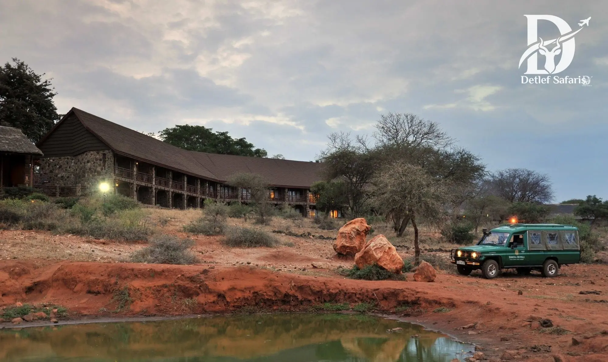 Kilaguni Serena Safari Lodge overlooking a waterhole with Mount Kilimanjaro behind, Tsavo West National Park, Kenya