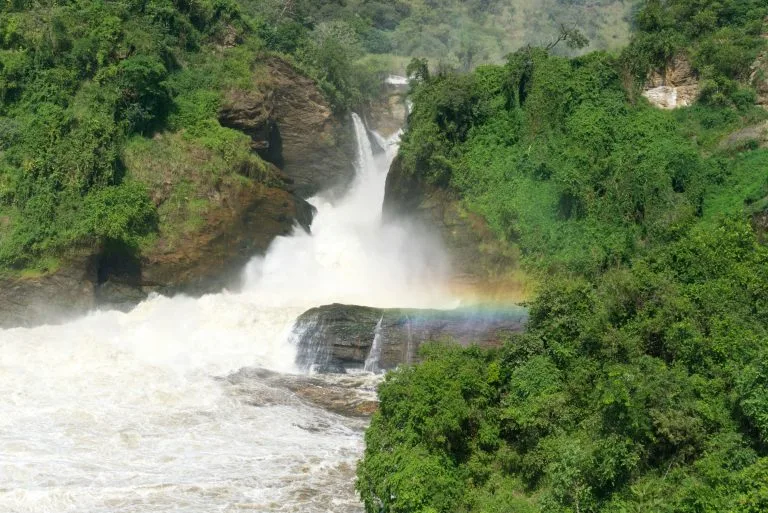 Murchison Falls in Murchison Falls National Park, Uganda, with a rainbow over the lower rapids