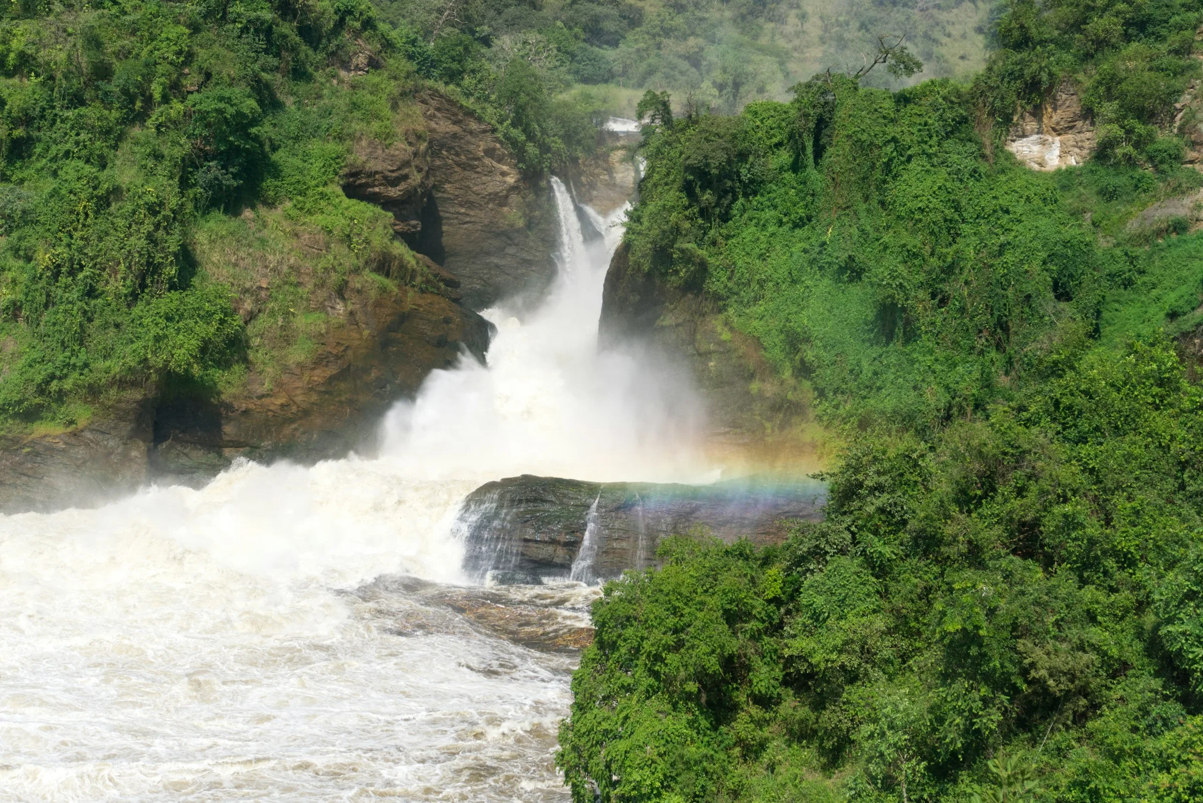Murchison Falls in Murchison Falls National Park, Uganda, with a rainbow over the lower rapids