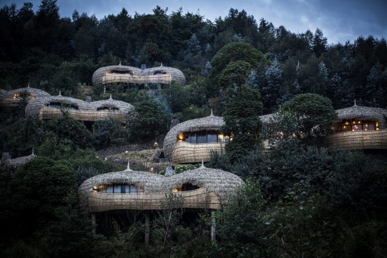 Bisate Lodge's round thatched villas on a forested hillside next to Volcanoes National Park, Rwanda